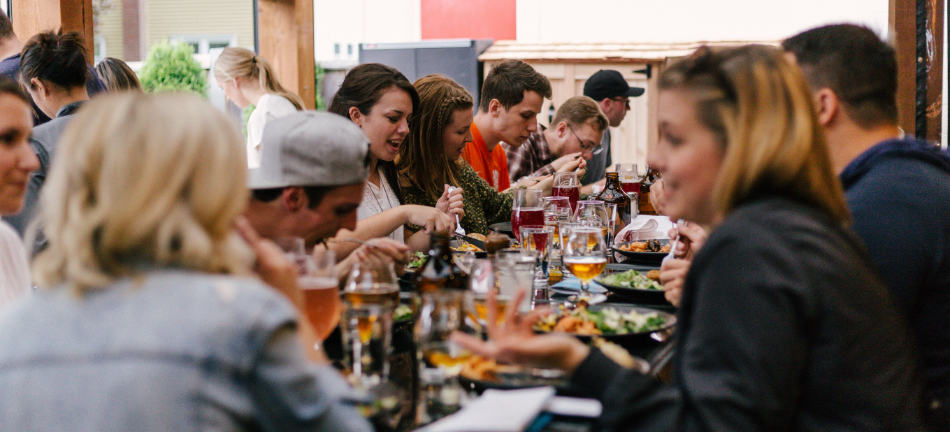 group of people eating after a stressful day 