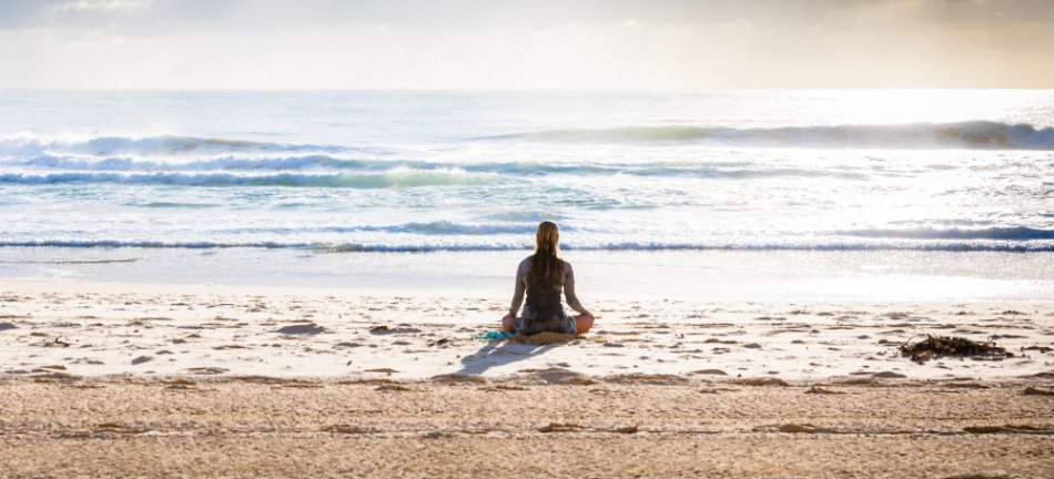 woman sitting on the beach after a stressful day 